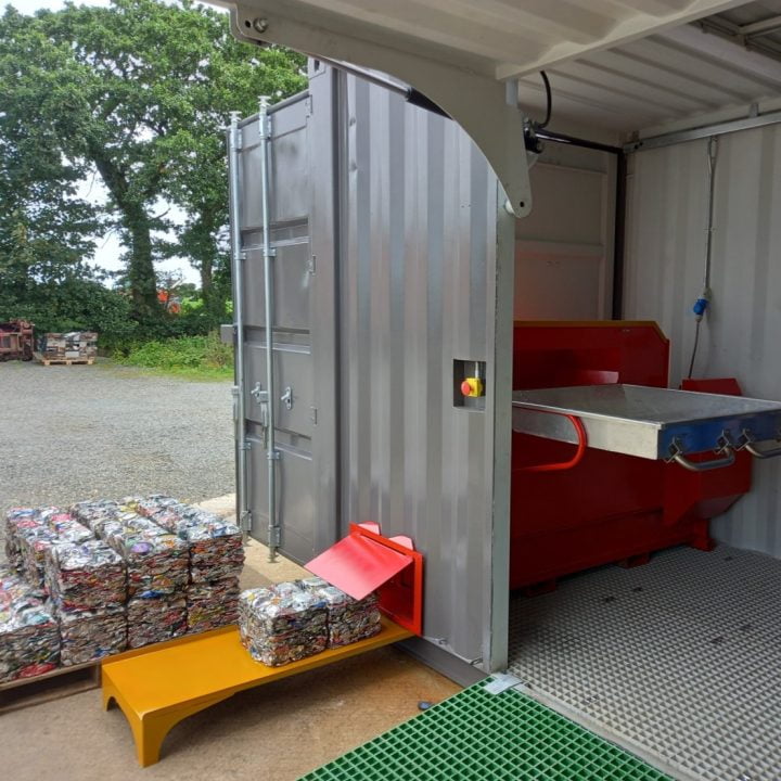 Clean stackable can bales coming out of Waste Baling Machine's RPU