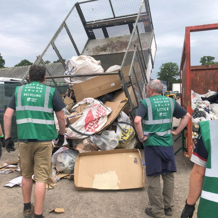 Tipper truck tips loose cardboard