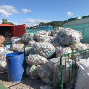 Pile of bin bags containing used drinks cans
